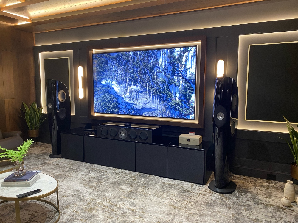 Standing KEF blade floorstanding speakers in midcentury modern lounge setting